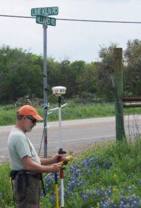 Andy Grubbs taking topo measurements off of Lime Kiln Road and Hilliard in San Marcos, TX